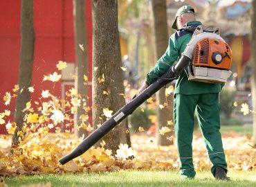 Man blowing leaves for Lawncare Services in Jackson, MS